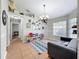 Open-concept living room with tile flooring, a modern sofa, and bright natural light at 2850 Tremont Dr, Eustis, FL 32726
