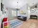 Comfortable living area with tile floors, a chandelier, and large windows for ample light at 2850 Tremont Dr, Eustis, FL 32726