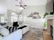 The living room features a fireplace, tile floor, and view to the entryway at 2850 Tremont Dr, Eustis, FL 32726