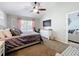 Main bedroom with ceiling fan, curtains and exercise bike at 2850 Tremont Dr, Eustis, FL 32726
