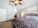 Main bedroom featuring a ceiling fan, a mirror, and an entry to the bathroom at 2850 Tremont Dr, Eustis, FL 32726