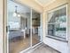 Exterior patio with sliding glass doors leading to the dining area and kitchen window at 2850 Tremont Dr, Eustis, FL 32726