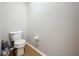 Enclosed toilet room with tile floors and toilet paper holder at 2850 Tremont Dr, Eustis, FL 32726