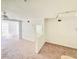 A well-lit living room with carpet and a large picture window adjacent to another room at 315 Grand Magnolia Ave # 112, Celebration, FL 34747