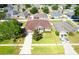 Aerial view of a single-story home featuring a large yard and convenient driveway at 36300 Grand Island Oaks Cir, Grand Island, FL 32735
