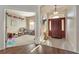 Inviting foyer with a decorative front door, tile flooring, and an adjacent playroom at 36300 Grand Island Oaks Cir, Grand Island, FL 32735