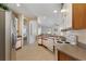 Bright kitchen with white cabinets, tile flooring, and modern appliances, providing a clean and functional space at 36300 Grand Island Oaks Cir, Grand Island, FL 32735