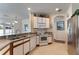 Functional kitchen with stainless steel appliances, tile flooring, and ample counter space at 36300 Grand Island Oaks Cir, Grand Island, FL 32735