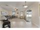 Comfortable living room with tile and carpet flooring and sliding glass door at 36300 Grand Island Oaks Cir, Grand Island, FL 32735