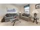 Well-lit living room showcases matching sofas, glass coffee table, and stylish decor at 36300 Grand Island Oaks Cir, Grand Island, FL 32735