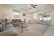 Inviting living room featuring a glass coffee table and neutral color palette at 36300 Grand Island Oaks Cir, Grand Island, FL 32735