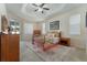 Serene main bedroom with trey ceiling, soft natural light, and carpet floors at 36300 Grand Island Oaks Cir, Grand Island, FL 32735