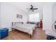 Bright bedroom with wood floors, ceiling fan and a sunny window at 4011 Venetian Bay Dr # 103, Kissimmee, FL 34741