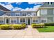Charming townhome with a well-manicured front yard, complete with lush greenery and a welcoming entrance at 4011 Venetian Bay Dr # 103, Kissimmee, FL 34741