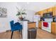 Cozy kitchen with wood cabinets, sleek countertops, and modern appliances at 4011 Venetian Bay Dr # 103, Kissimmee, FL 34741
