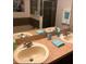 Bathroom with double vanity and framed mirror at 4126 Hedge Maple Pl, Winter Springs, FL 32708