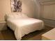 Cozy bedroom with a comfortable bed and artwork at 4126 Hedge Maple Pl, Winter Springs, FL 32708
