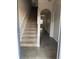 Inviting entryway with tile flooring and carpeted staircase leading to the upper level at 4126 Hedge Maple Pl, Winter Springs, FL 32708