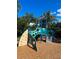 Community playground with climbing features and slide at 4126 Hedge Maple Pl, Winter Springs, FL 32708