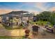 Beautiful screened patio and outdoor firepit with seating in landscaped backyard at 421 Thomez Ct, Lake Mary, FL 32746