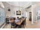 Spacious dining room with elegant chandelier, detailed trim, and plenty of room to host gatherings at 421 Thomez Ct, Lake Mary, FL 32746