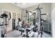Well-equipped exercise room with a variety of fitness machines and neutral-colored walls at 421 Thomez Ct, Lake Mary, FL 32746