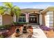 Inviting home entrance showcasing a well-maintained walkway, landscape features, and double doors at 421 Thomez Ct, Lake Mary, FL 32746