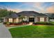 Stunning single-story home showcasing lush landscaping, mature trees, and classic architectural details at 421 Thomez Ct, Lake Mary, FL 32746