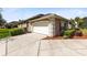 This home offers a two-car garage and a long driveway for parking at 421 Thomez Ct, Lake Mary, FL 32746