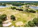 Scenic aerial view of the golf course with lush green fairways, sand traps, and surrounding trees at 421 Thomez Ct, Lake Mary, FL 32746