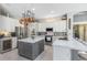 Elegant kitchen featuring marble countertops, stainless steel appliances, and a stylish kitchen island at 421 Thomez Ct, Lake Mary, FL 32746