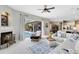 Bright living room boasts comfortable seating, a fireplace, and access to the screened in lanai and pool at 421 Thomez Ct, Lake Mary, FL 32746