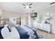 Bedroom boasts neutral tones, carpet floors, a ceiling fan, and ample natural light from the window at 421 Thomez Ct, Lake Mary, FL 32746
