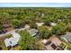 Aerial view of home with fenced-in pool area in an established neighborhood with lots of trees at 4371 Vestawood Ct, Sanford, FL 32773