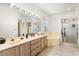 Bright bathroom features a large vanity, soaking tub, and glass-enclosed shower at 4371 Vestawood Ct, Sanford, FL 32773