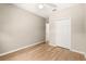 Neutral bedroom featuring hardwood floors, a ceiling fan, and a closet with ample storage at 4371 Vestawood Ct, Sanford, FL 32773