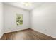 Cozy bedroom with hardwood floors and a bright window offering natural light at 4371 Vestawood Ct, Sanford, FL 32773