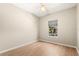 Neutral bedroom with hardwood floors, a ceiling fan, and a sun-filled window at 4371 Vestawood Ct, Sanford, FL 32773
