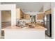 Functional kitchen featuring stainless steel appliances, a breakfast bar, and ample counter space at 4371 Vestawood Ct, Sanford, FL 32773