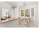 Bright breakfast nook featuring a round table set near windows, adjacent to the kitchen area at 4371 Vestawood Ct, Sanford, FL 32773