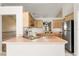 Functional kitchen featuring stainless steel appliances, a breakfast bar, and ample counter space at 4371 Vestawood Ct, Sanford, FL 32773