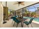 Lanai has a ceiling fan, table, chairs, and view of the swimming pool at 4371 Vestawood Ct, Sanford, FL 32773