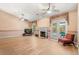 Inviting living room featuring a fireplace, wood floors, and glass doors leading to outdoor space at 4371 Vestawood Ct, Sanford, FL 32773
