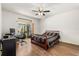 Bedroom featuring hardwood floors, ceiling fan, natural light and a workstation at 4371 Vestawood Ct, Sanford, FL 32773