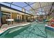 Swimming pool with clear water, lounge chairs, and lush landscaping at 4371 Vestawood Ct, Sanford, FL 32773