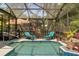 Swimming pool with lounge chairs, water feature, and screened enclosure at 4371 Vestawood Ct, Sanford, FL 32773