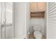 Toilet room has a toilet, cabinet, and a shelf at 4371 Vestawood Ct, Sanford, FL 32773