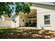 This backyard features a covered patio and a spacious grassy area at 4522 Weeping Willow Cir, Casselberry, FL 32707