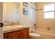 The bathroom offers a vanity with a large mirror and shower with blue accents at 4522 Weeping Willow Cir, Casselberry, FL 32707