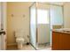 This bathroom offers a glass-enclosed shower with pebble floor and classic fixtures at 4522 Weeping Willow Cir, Casselberry, FL 32707